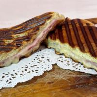  Portuguese Panini In Croissant · Ham and Cheese panini on Portuguese Croissant. Served with potato strings.