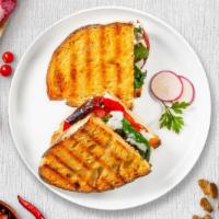 Meatless Panini · Mozzarella cheese, tomatoes, spinach, and sun dried tomatoes. on toasted bread.