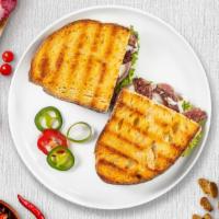 Russian Panini · Roasted beef, Muenster cheese, caramelized onions, lettuce, plum tomatoes, and Russian dress...