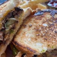 Philly Steak Melt - Full · Pressed Italian bread, sliced steak, grilled peppers, onions, and mushrooms, American cheese...