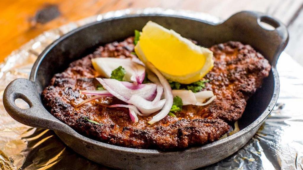 Tunde Ka Kabab · Minced lamb kebabs with Indian spices that melt in your mouth
