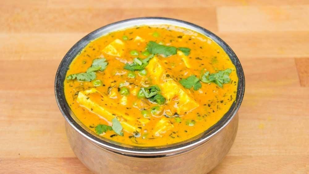Mutter Paneer · Cheese, green peas, and creamy tomato sauce.