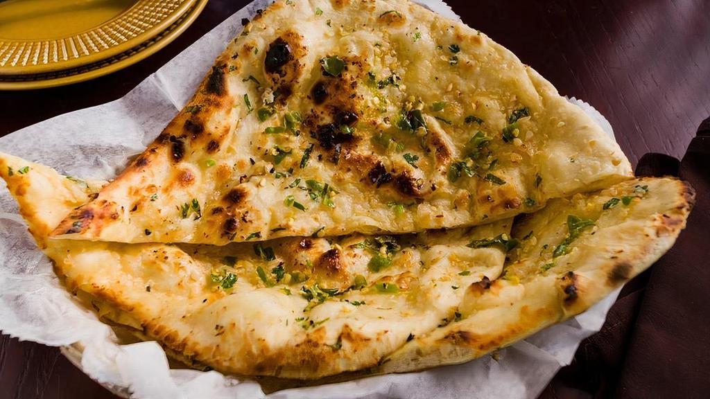 Chili Dhaniya Naan · Tandoor fired white flour bread with chili and cilantro