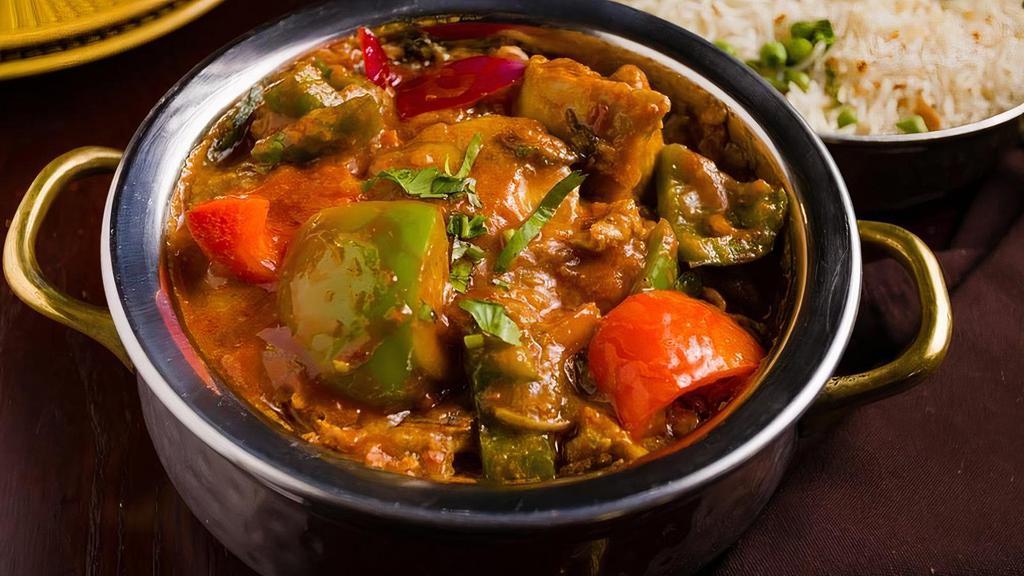 Kadai Chicken · Chicken cooked with Onions, bell pepper, fenugreek, and green chili.
