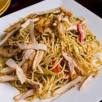 Chicken Hakka Noodles · Noodles tossed with chicken and soy sauce