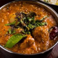 Lamb Madras · Coconut, dry red chilies, and curry leaves.