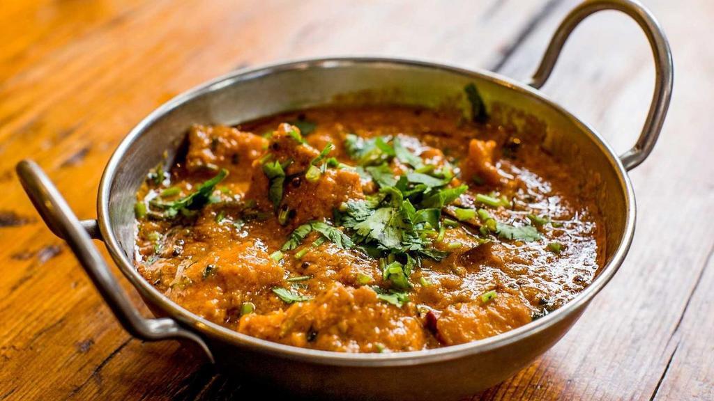 Goan Fish Curry · Tamarind, coconut, and curry leaves.