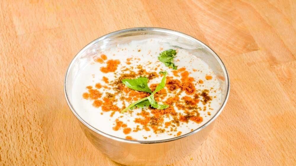 Bhurani Timatar Raita · Yogurt with tomato, garlic, and cumin.