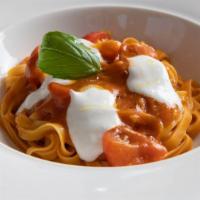 Fettuccine Pomodoro · Housemade Fettuccine with Fresh Tomato Sauce, Burrata  and and Basil.