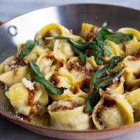 Tortellini · Tortellini filled with Burrata,  over Tomato Confit, Sage Butter and Parmigiano
