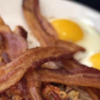 Meat Lovers · Two large eggs, bacon strips, sausage & ham, served with home fries & toast.