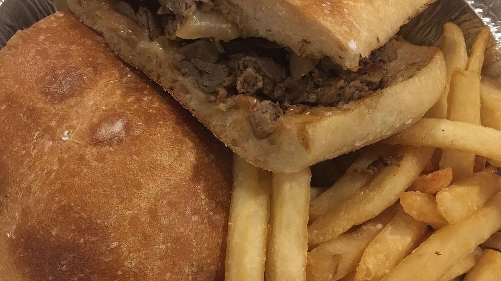 Philly Style Cheese Steak · Grilled sliced steak with onions & melted Swiss on hero bread.
