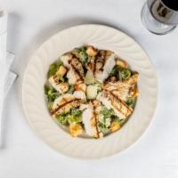 Traditional Caesar Salad · Anchovies, herb croutons, shaved Parmesan.