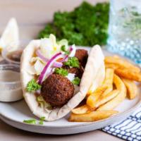 Falafel Pita Sandwich · Crispy falafel balls with your choice of toppings wrapped in fresh pita.