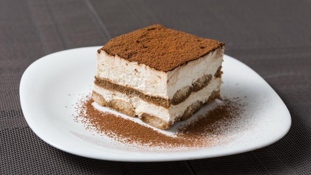 Tiramisu · Delicate coffee dipped lady fingers, layered with a creamy mascarpone filling and a hint of cocoa.