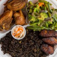 Fried Chicken · Served with black rice and peas white rice and fried green or sweet plantain.
