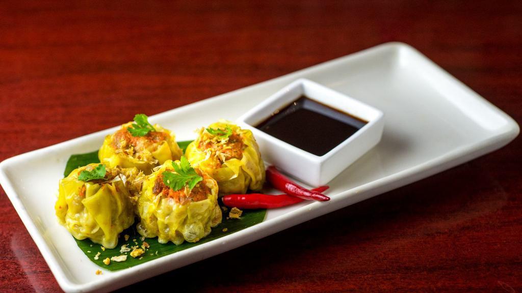 Thai Dumpling · Ground chicken, carrots, water chestnuts w/tangy soy sauce.