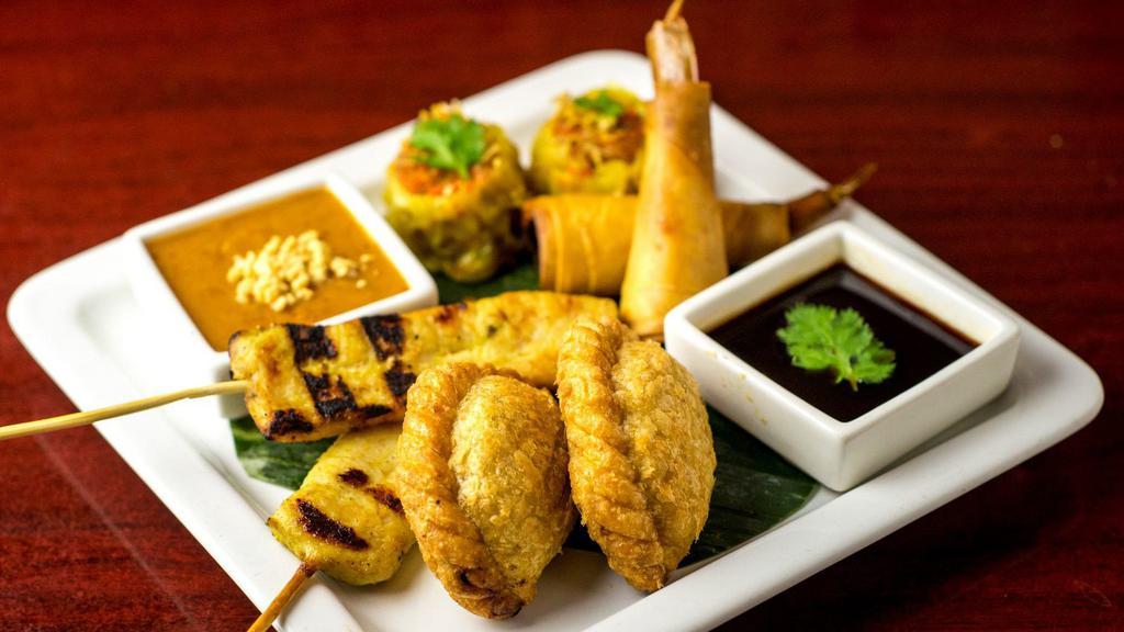Combo Appetizers · Combinations of curry puff, chicken sate, Thai dumpling and shrimp roll and edamame