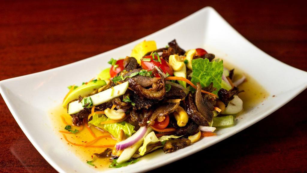 Crispy Duck Salad · Little spicy. Sliced crispy duck, pineapple, cashew nut, onion, and mixed green.