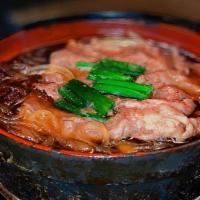 Beef Washugyu Sukiyaki · Served in stone pot with assorted vegetables, mushrooms and glass noodle. Side of poached eg...