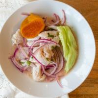 Ceviche De Pescado · Diced fish, red onions, sweet potato and corn marinated in lime juice.