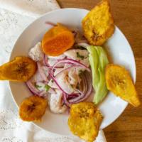 Ceviche Calu Pescado · Diced fish, red onions, corn marinated in lime juice, served with tostones.