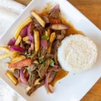 Lomo Saltado · Sliced beefs, onion, tomatoes, and fries sautéed. Served with white rice.