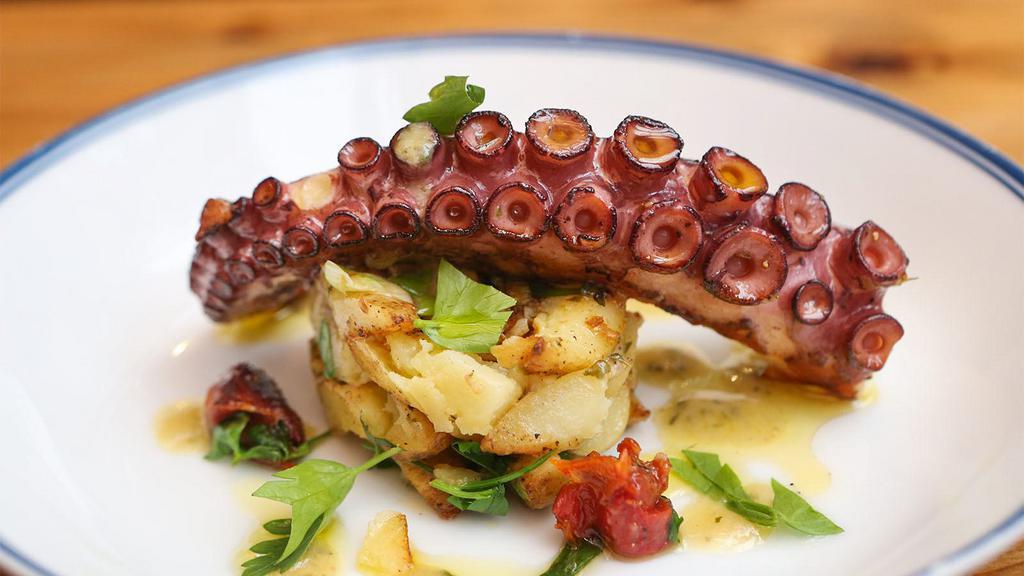 Polipo E Patate · Seared octopus, fingerling potatoes, oven-dried plum tomatoes, parsley, scallions, garlic vinaigrette.
