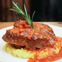 Ossobuco Alla Milanese · Slow braised veal shank served over saffron risotto.