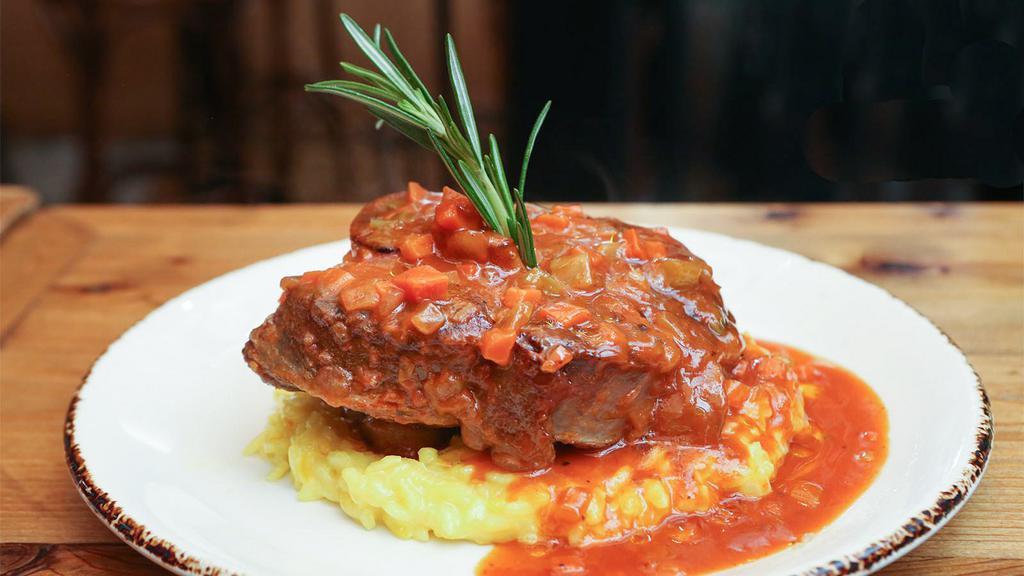 Ossobuco Alla Milanese · Slow braised veal shank served over saffron risotto.