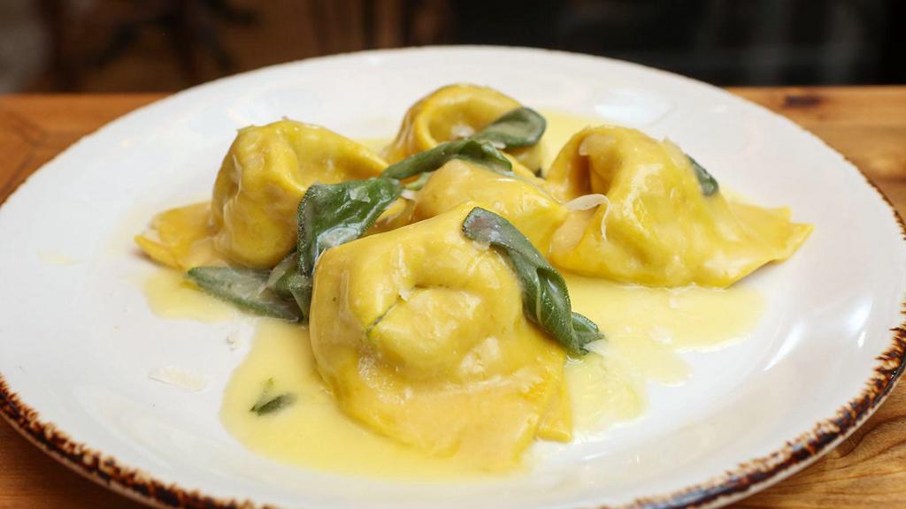 Tortelloni Al Burro E Salvia · Homemade tortellini with spinach and ricotta filling in butter sage sauce.