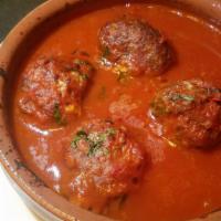 Polpettine Al Forno · Meatballs in a tomato sauce
cooked in a brick oven