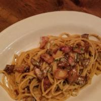 Spaghetti Carbonara · Spaghetti with crispy bacon, egg yolk, parmesan cheese, black pepper.