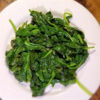 Spinaci Saltati · Sauteed spinach.