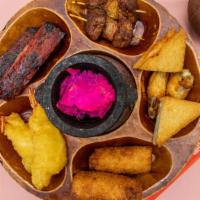 Pu Pu Platter (For 2) · A combination of hor-d'oeuvres. You may toast all the shrimp toast, Hawaii beef, fantail shr...