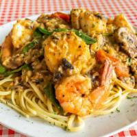Scallop And Shrimp With Lobster Cream Sauce · Scallops, shrimp, mushrooms, tomatoes, and spinach in a lobster cream sauce.