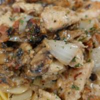 Chicken Casino · Chicken sautéed with bacon, mushrooms, and onions in a garlic butter white wine sauce.