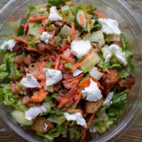 Farm Table Salad · chopped romaine, vegetables, grape tomatoes, walnuts, First Light Farms goat cheese, and cro...