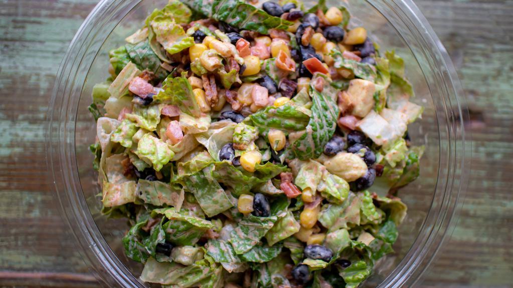 Southwest Salad · chopped romaine, bacon, black beans, corn, avocado, and grape tomatoes with a pepper-lime dressing.