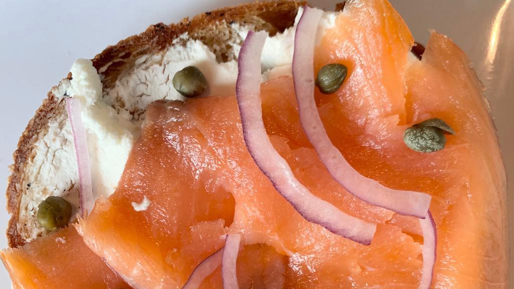 Smoked Salmon Toast · FirstLight Farms goat cheese, gravlox, red onion, and capers served on grilled table bread.