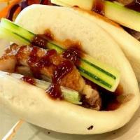 A-1 Duck Buns · Roasted duck, cucumber, scallion, with spicy Hoisin sauce. **If you need plastic utensils, p...