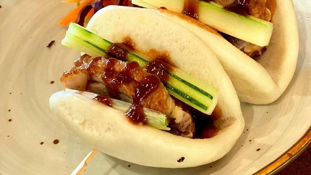 A-1 Duck Buns · Roasted duck, cucumber, scallion, with spicy Hoisin sauce. **If you need plastic utensils, please request.**