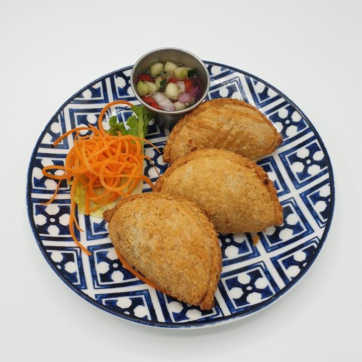 A-9 Curry Puffs · Curry flavored chicken, potato and onion in crispy puff pastry, served with cucumber relish. **If you need plastic utensils, please request.**