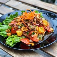 Sa-4 Duck Salad · Crispy roasted duck, pineapple, tomato, cashew nut, red onion, and scallion, in sweet and sp...