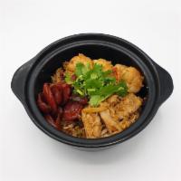 M-8 Clay Pot Rice · Rice cooked in sweet soy sauce with sweet Thai sausage, pork, shrimp, ginger, mushroom, egg,...