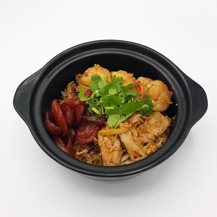 M-8 Clay Pot Rice · Rice cooked in sweet soy sauce with sweet Thai sausage, pork, shrimp, ginger, mushroom, egg, scallion, and cilantro **If you need plastic utensils, please request.**