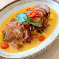 M-10 Lychee Duck Curry · Half crispy roasted duck with lychee, pineapple,  tomato, string bean, bell pepper, and basi...