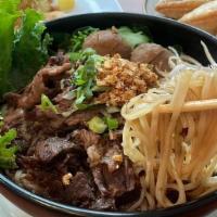 Ns-2 Beef Noodle Soup · Choice of noodles in stewed beef, beef, beef balls, bean sprout, cilantro, and scallion in d...