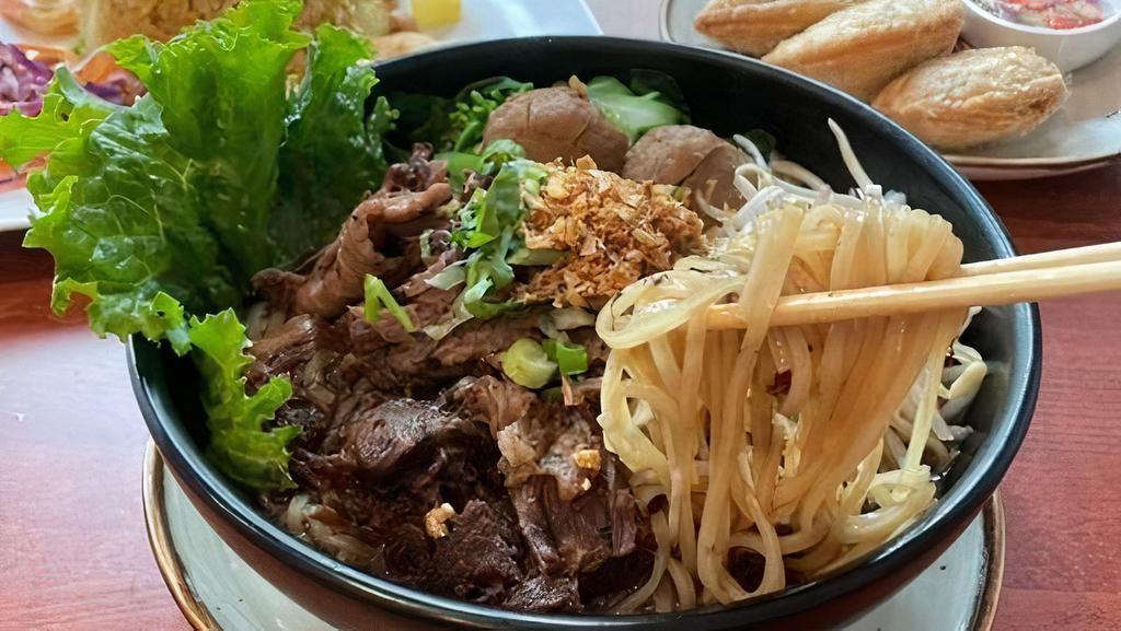 Ns-2 Beef Noodle Soup · Choice of noodles in stewed beef, beef, beef balls, bean sprout, cilantro, and scallion in dark broth. **If you need plastic utensils, please request.**