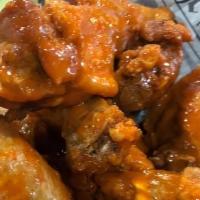 Wings (12) · Crispy Chicken Wings (12) in choice of sauce, served with homemade blue cheese dressing.